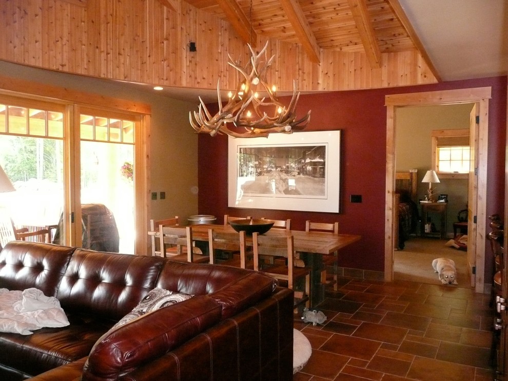 Example of a mid-sized mountain style porcelain tile great room design in Seattle with red walls and no fireplace