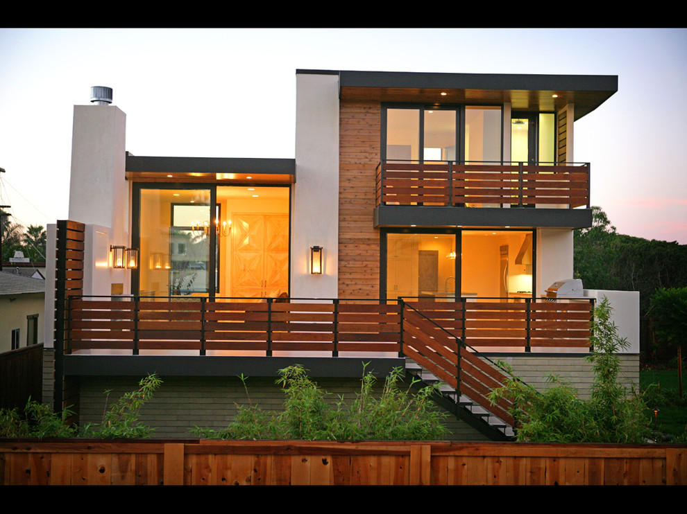This is an example of a small contemporary two-storey exterior in San Diego with mixed siding.