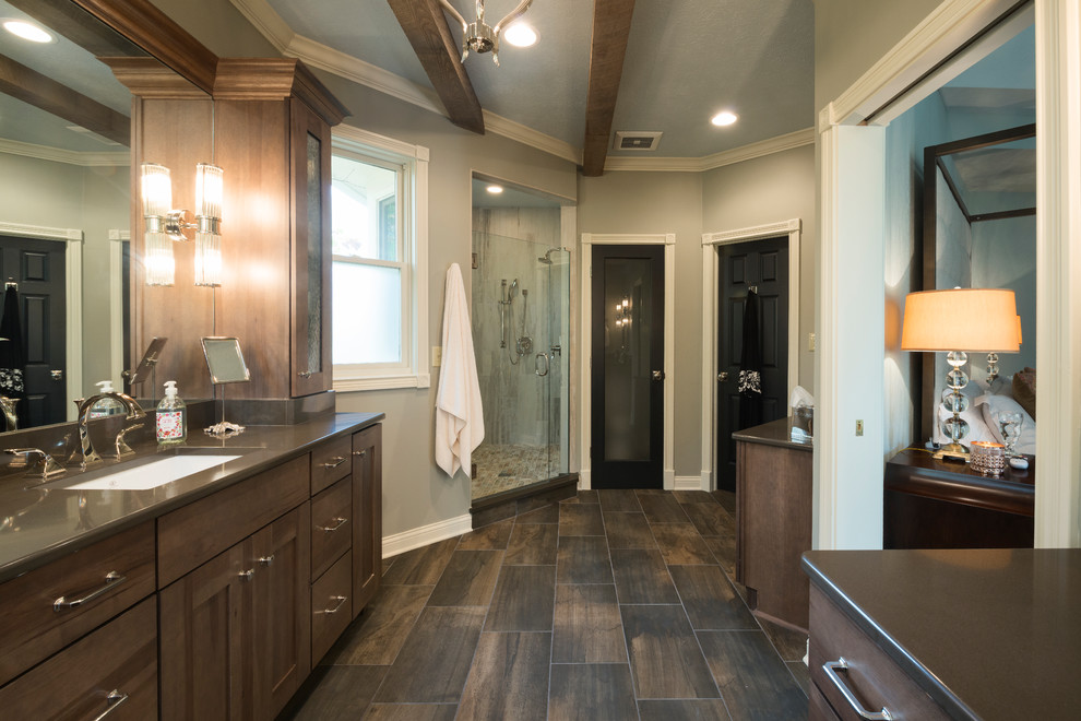 Photo of a large arts and crafts master wet room bathroom in Indianapolis with flat-panel cabinets, brown cabinets, brown tile, ceramic tile, grey walls, ceramic floors, an undermount sink and quartzite benchtops.