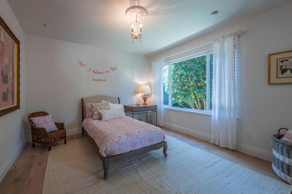 Mid-sized transitional kids' bedroom in Los Angeles with grey walls, medium hardwood floors and brown floor for kids 4-10 years old and girls.