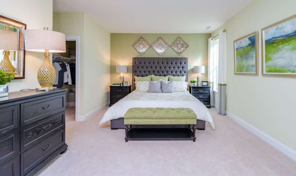Photo of a large transitional master bedroom in Philadelphia with green walls, carpet and beige floor.