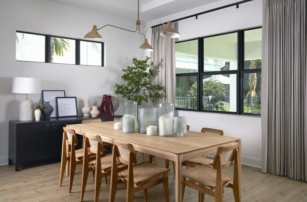 Dining room - coastal light wood floor, beige floor and tray ceiling dining room idea in New York with white walls