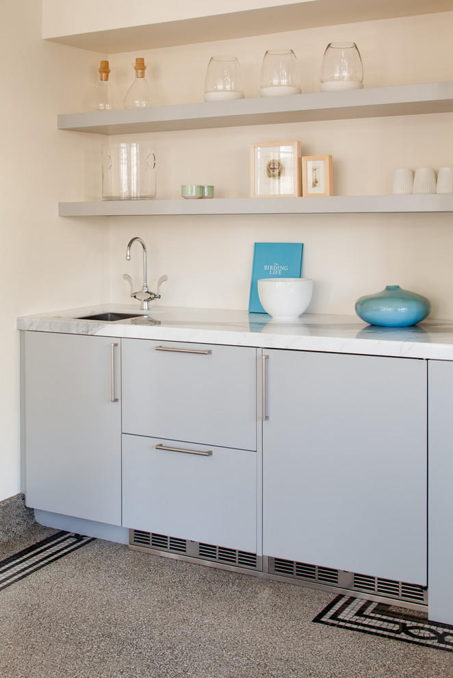 Inspiration for a small contemporary laundry room in Milwaukee.