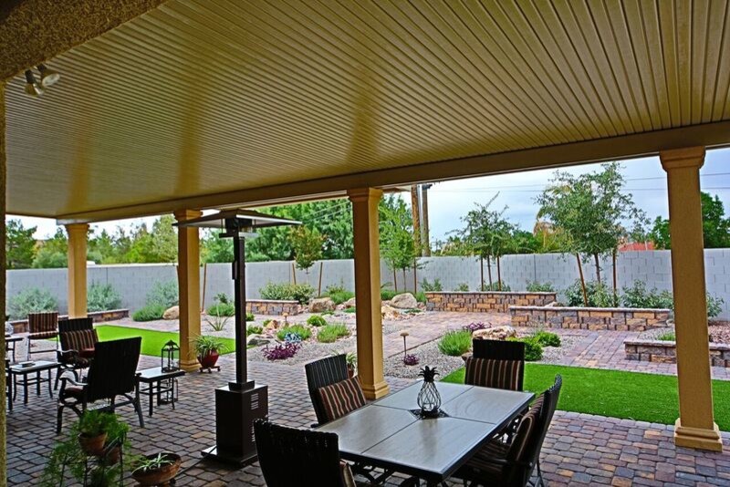 Photo of a mid-sized traditional backyard formal garden in Las Vegas with brick pavers.