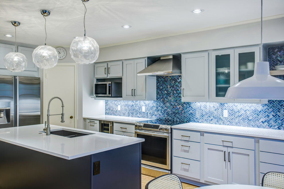 Design ideas for a large modern l-shaped eat-in kitchen in Dallas with an undermount sink, shaker cabinets, blue cabinets, quartz benchtops, blue splashback, mosaic tile splashback, stainless steel appliances, cork floors, with island, brown floor and white benchtop.