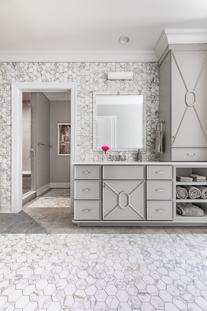 This is an example of a transitional master bathroom in Chicago with white tile, marble, marble floors, marble benchtops, white floor and white benchtops.