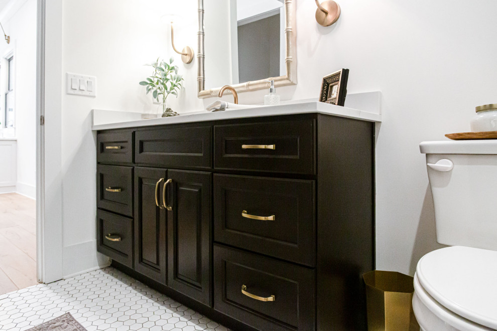This is an example of a mid-sized country kids bathroom in Atlanta with raised-panel cabinets, black cabinets, engineered quartz benchtops, white benchtops, a single vanity and a built-in vanity.