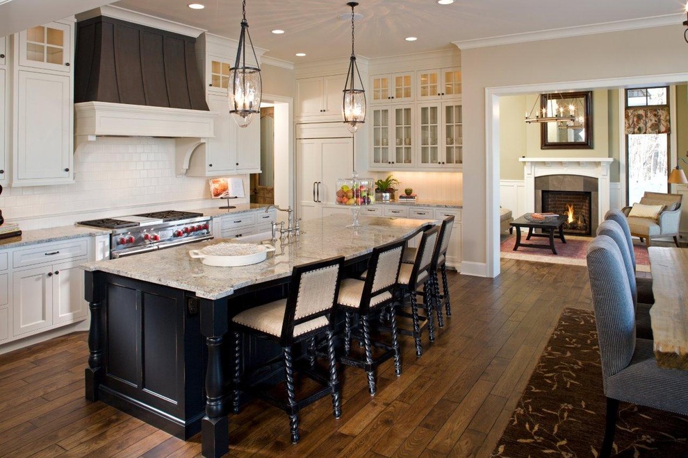 Traditional eat-in kitchen in Miami with panelled appliances and white cabinets.