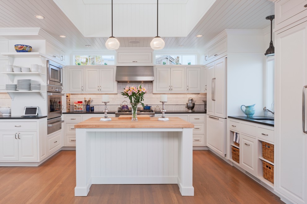 Design ideas for a beach style u-shaped kitchen in Seattle with with island.