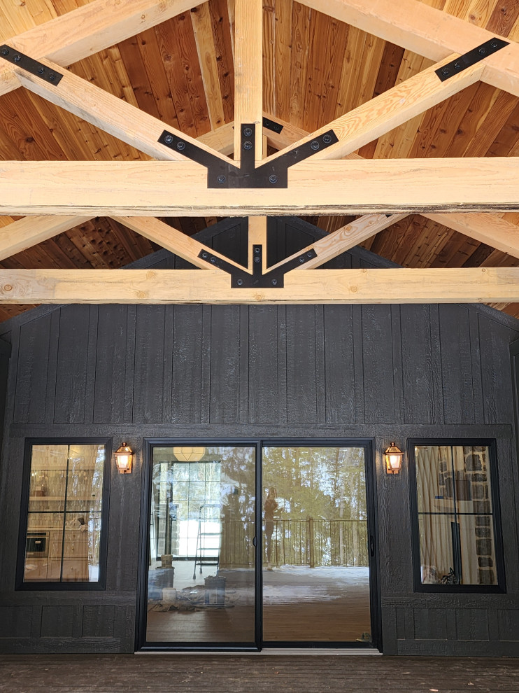 Deck - large transitional backyard metal railing deck idea