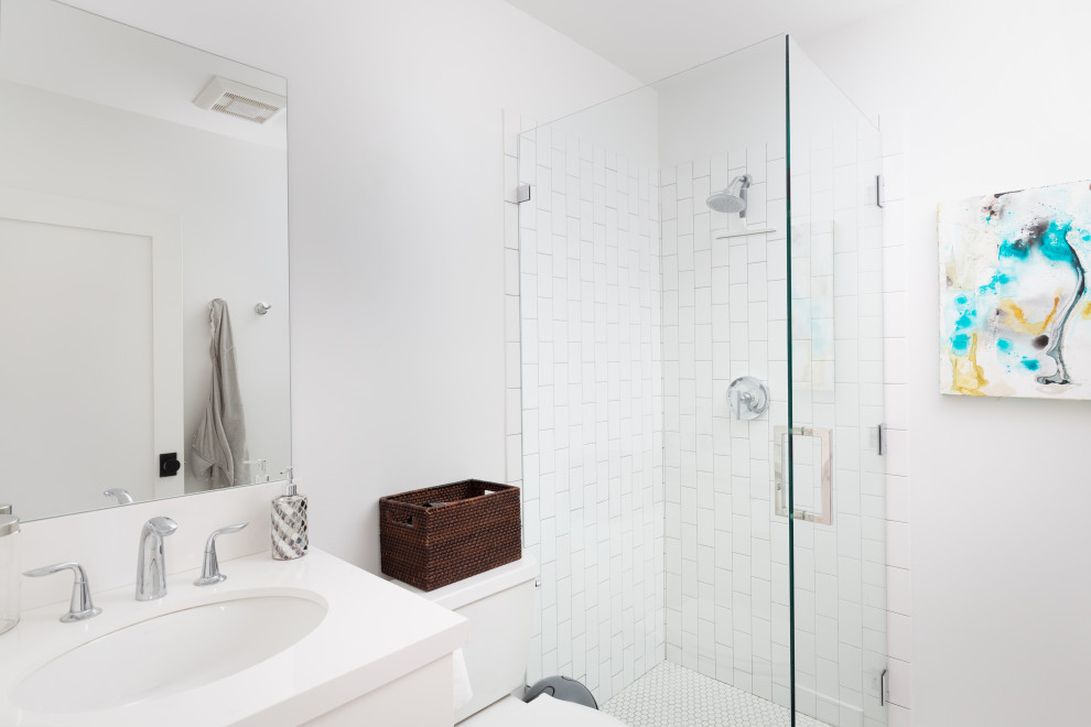 Photo of a small contemporary 3/4 bathroom in Los Angeles with flat-panel cabinets, white cabinets, a corner shower, a two-piece toilet, white tile, ceramic tile, white walls, an undermount sink, a hinged shower door, a single vanity and a built-in vanity.