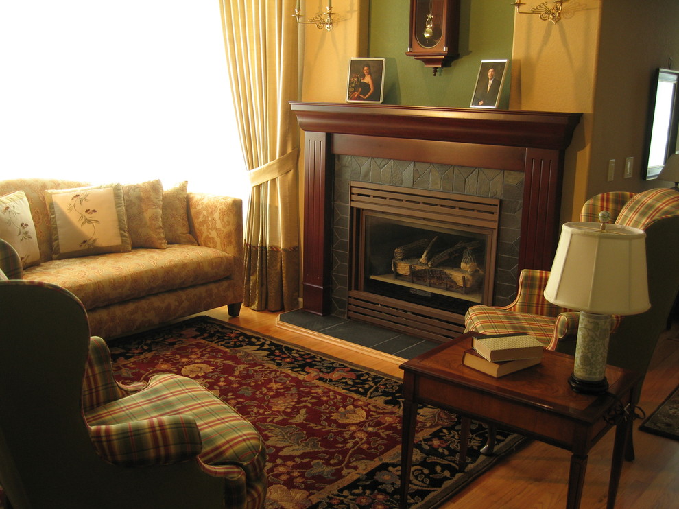 Traditional formal enclosed living room in Boise with beige walls, medium hardwood floors, a standard fireplace, a tile fireplace surround and brown floor.