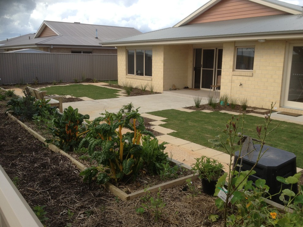 Design ideas for a small beach style backyard full sun garden in Geelong with a vegetable garden and concrete pavers.