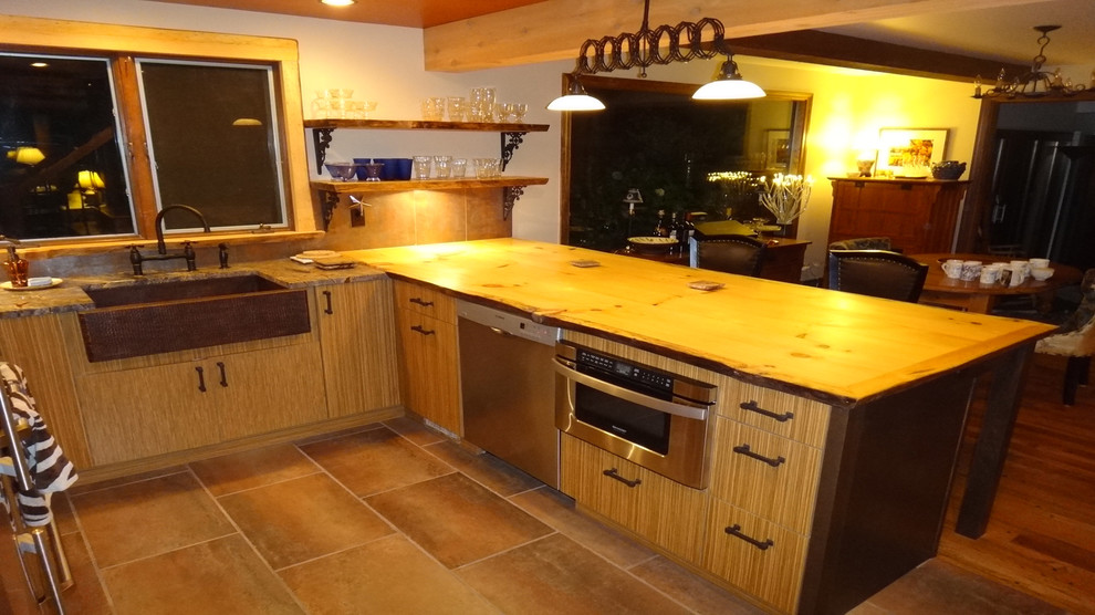Kitchen - mid-sized rustic kitchen idea with medium tone wood cabinets, wood countertops, metallic backsplash and an island