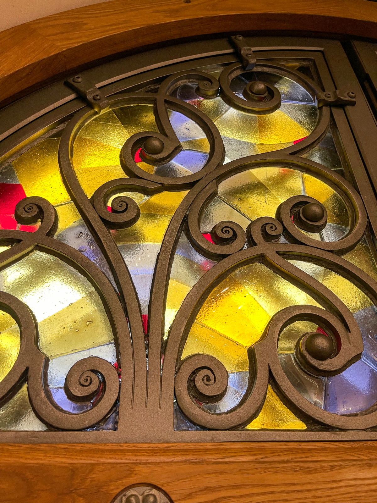 Кованые двери в Храм с витражными окнами.