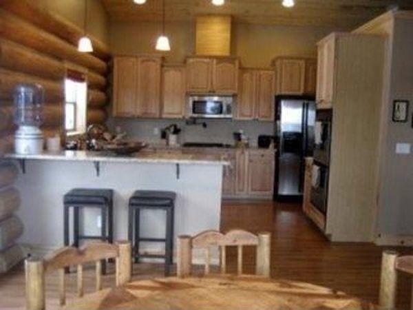 Inspiration for a mid-sized rustic l-shaped open concept kitchen remodel with recessed-panel cabinets and light wood cabinets