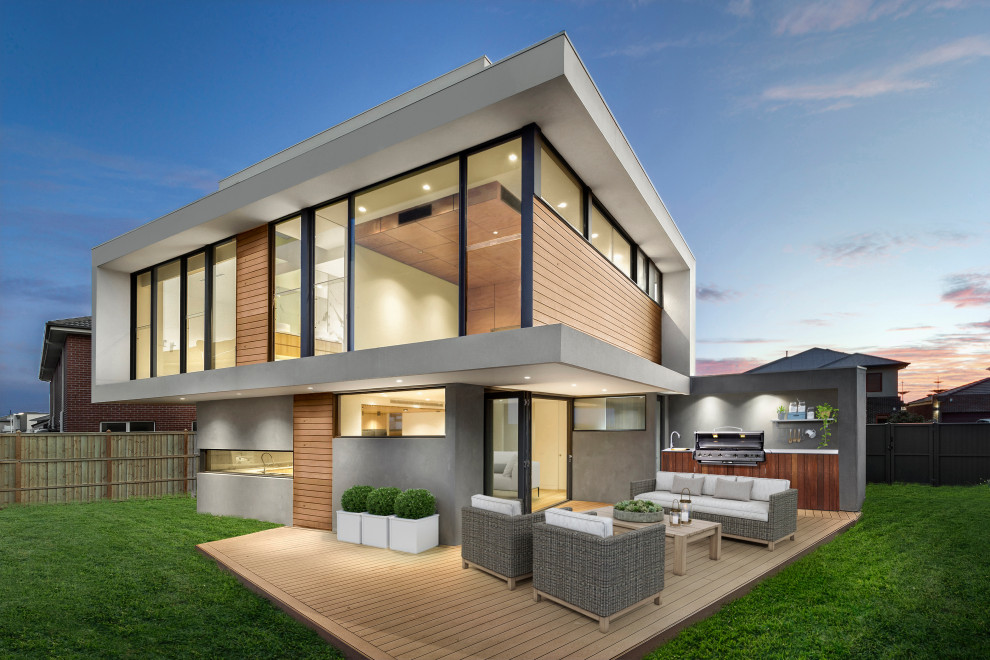Design ideas for a mid-sized contemporary three-storey multi-coloured house exterior in Melbourne with wood siding, a flat roof and a metal roof.