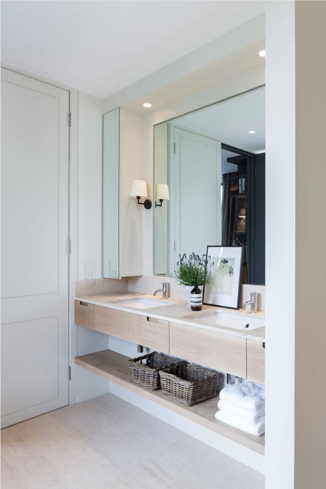 Design ideas for a mid-sized beach style master bathroom in Orange County with flat-panel cabinets, beige cabinets, white walls, an undermount sink, beige floor, white benchtops, a double vanity and a floating vanity.