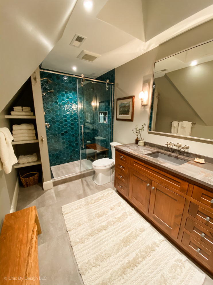 Inspiration for a country bathroom in Other with shaker cabinets, brown cabinets, a two-piece toilet, green tile, terra-cotta tile, grey walls, ceramic floors, an undermount sink, engineered quartz benchtops, grey floor, a sliding shower screen and grey benchtops.