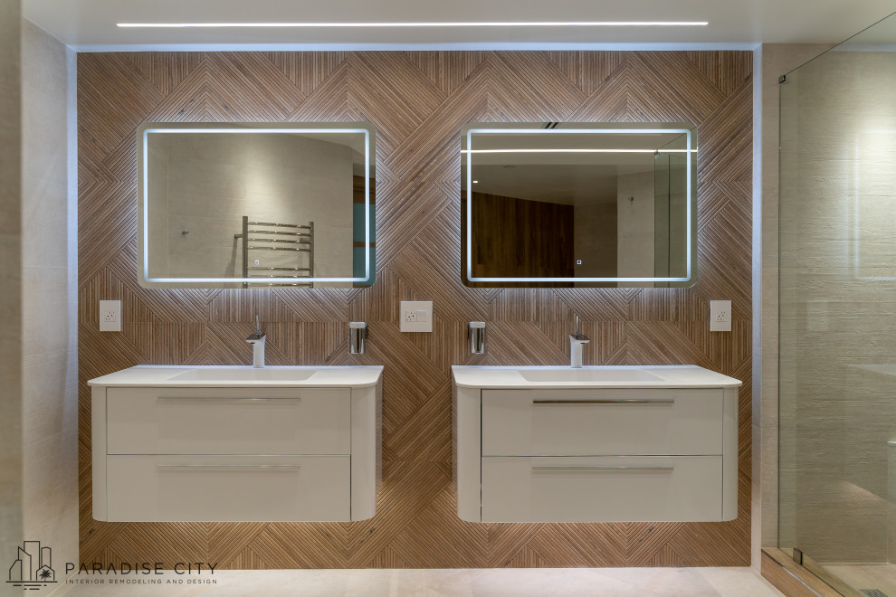This is an example of a large contemporary master bathroom in Other with glass-front cabinets, white cabinets, a double shower, an urinal, beige tile, ceramic tile, porcelain floors, an integrated sink, engineered quartz benchtops, beige floor and a hinged shower door.