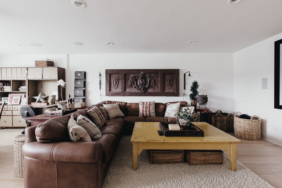 Mid-sized mountain style open concept light wood floor family room photo in Vancouver with white walls