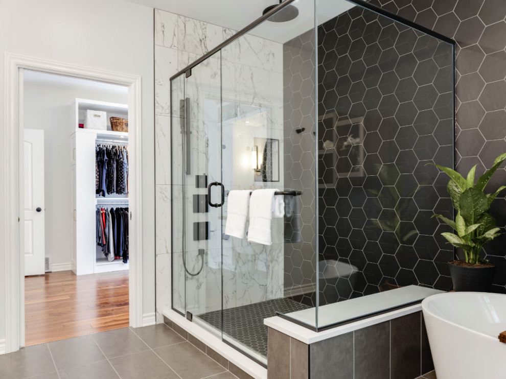 Design ideas for a large contemporary master bathroom in Ottawa with flat-panel cabinets, medium wood cabinets, a freestanding tub, a corner shower, porcelain tile, porcelain floors, an undermount sink, engineered quartz benchtops, grey floor, a hinged shower door, white benchtops, a shower seat, a single vanity and a freestanding vanity.