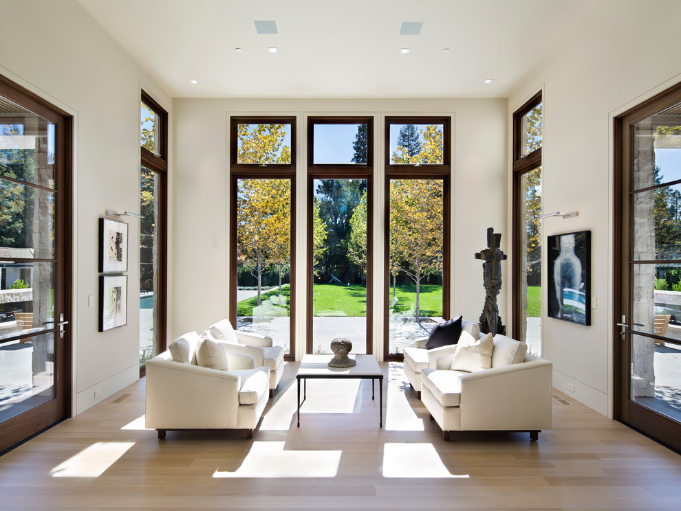 Inspiration for a mid-sized contemporary formal and open concept light wood floor and beige floor living room remodel in San Francisco with beige walls, no fireplace and no tv