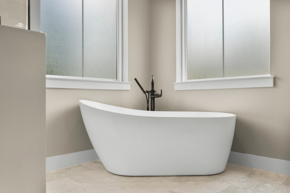 Example of a mid-sized arts and crafts master beige tile and porcelain tile porcelain tile, beige floor and double-sink freestanding bathtub design with shaker cabinets, beige cabinets, a two-piece toilet, beige walls, an undermount sink, quartzite countertops, a hinged shower door, beige countertops and a built-in vanity