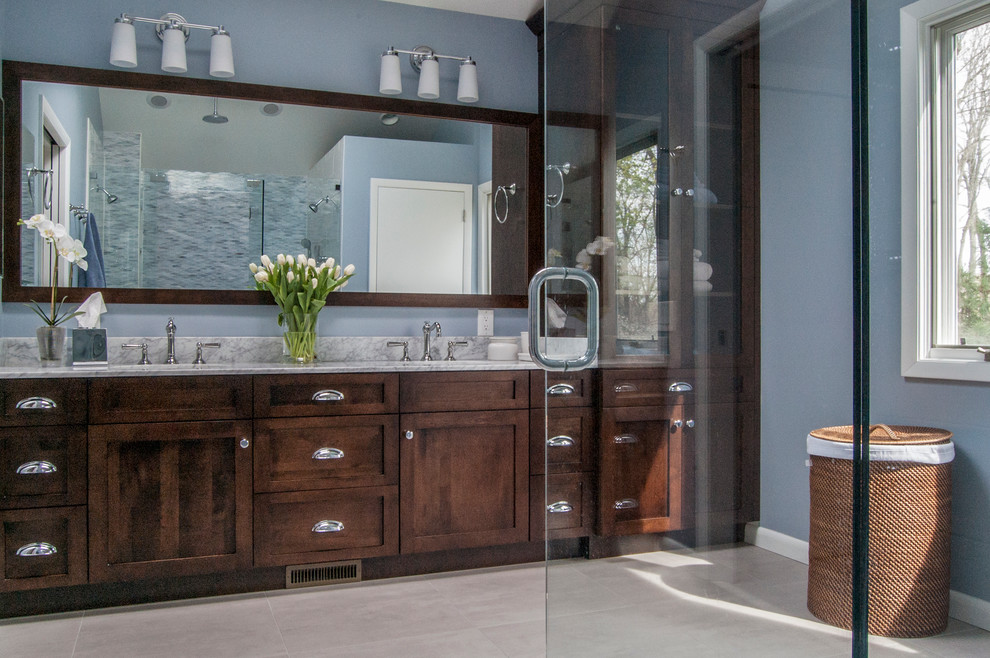 Photo of a large transitional master bathroom in Philadelphia with an undermount sink, shaker cabinets, dark wood cabinets, granite benchtops, a double shower, white tile, stone tile, blue walls and porcelain floors.