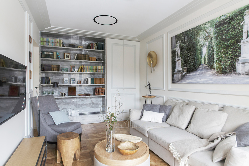 Mid-sized transitional enclosed living room in Moscow with a library, light hardwood floors, a ribbon fireplace, a stone fireplace surround, a wall-mounted tv, white walls and brown floor.