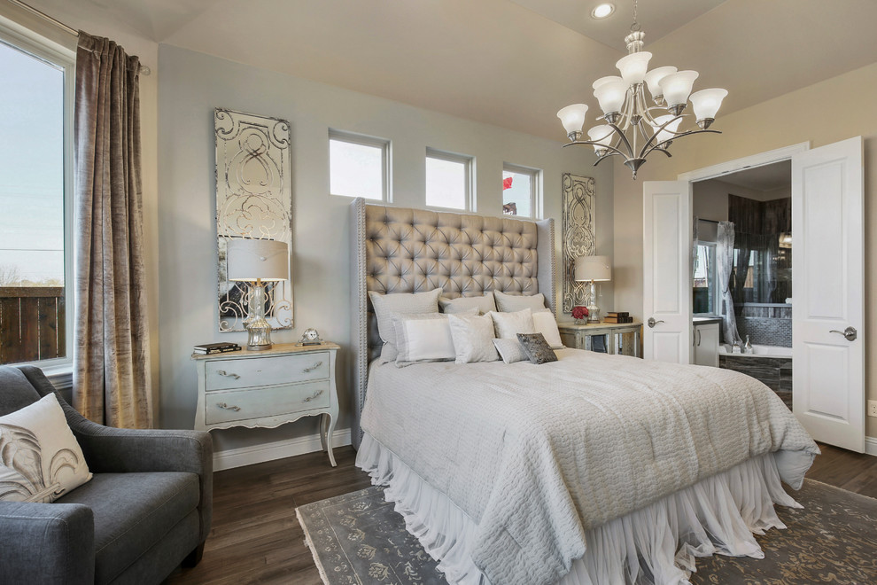 Design ideas for a large country master bedroom in Dallas with beige walls, dark hardwood floors and brown floor.