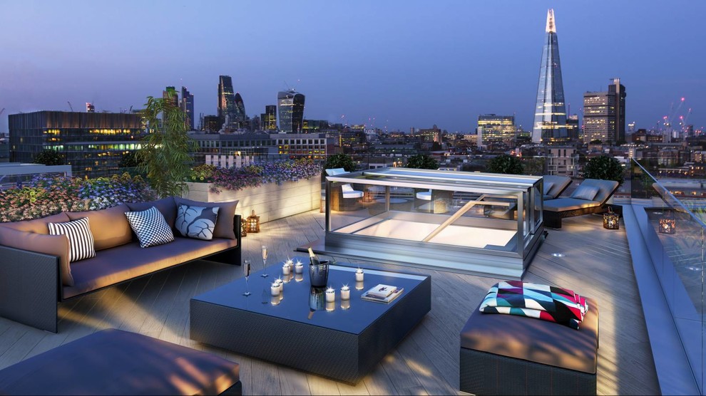 Photo of a mid-sized contemporary rooftop and rooftop deck in London with a container garden and no cover.