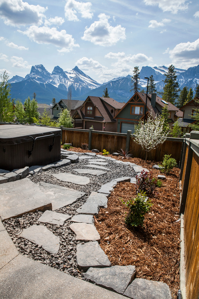 Example of a mountain style home design design in Calgary