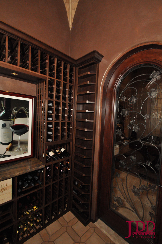 Mid-sized midcentury wine cellar in San Diego with porcelain floors and display racks.