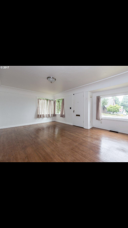 Cottage With Front Door In The Middle Of Living Room