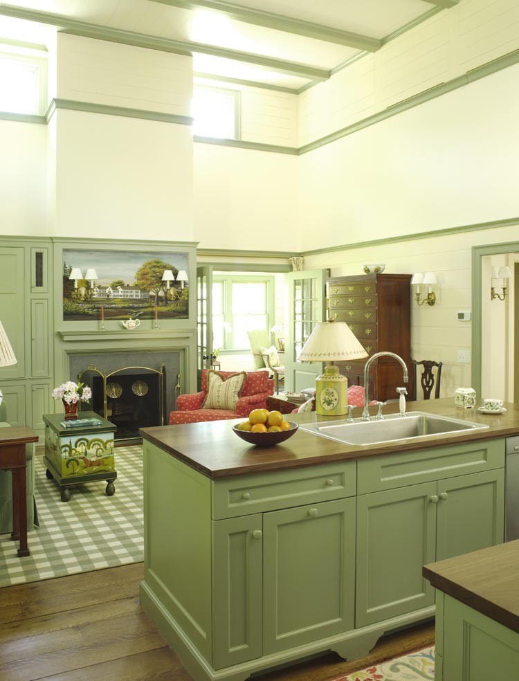 Inspiration for a small country galley dark wood floor open concept kitchen remodel in New York with a drop-in sink, flat-panel cabinets, green cabinets, wood countertops, green backsplash, mosaic tile backsplash, stainless steel appliances and an island