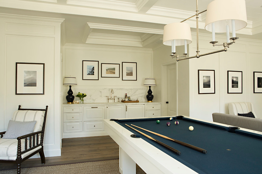 Photo of a large beach style open concept family room in San Francisco with a game room, white walls, medium hardwood floors, no fireplace, no tv and brown floor.