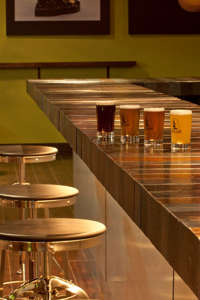 Photo of an expansive industrial home bar in San Diego.