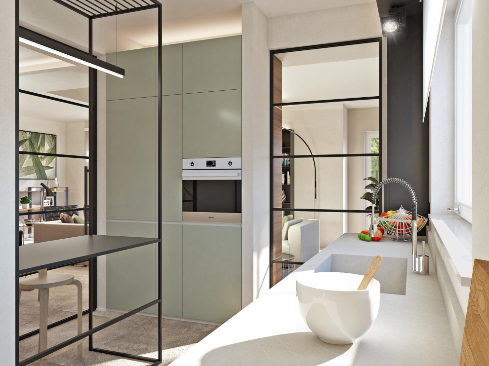 This is an example of a small contemporary l-shaped separate kitchen in Milan with an integrated sink, flat-panel cabinets, green cabinets, quartz benchtops, grey splashback, stainless steel appliances, porcelain floors, grey benchtop, no island and grey floor.