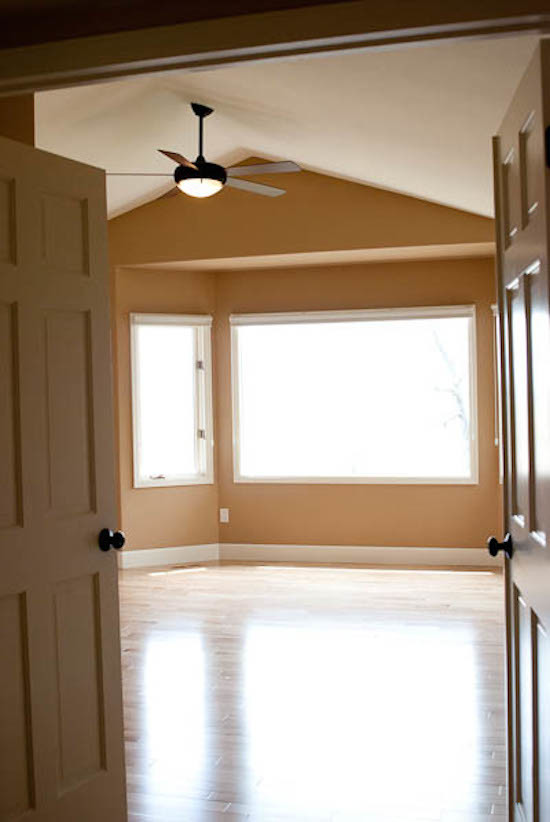 Example of a transitional bedroom design in Denver
