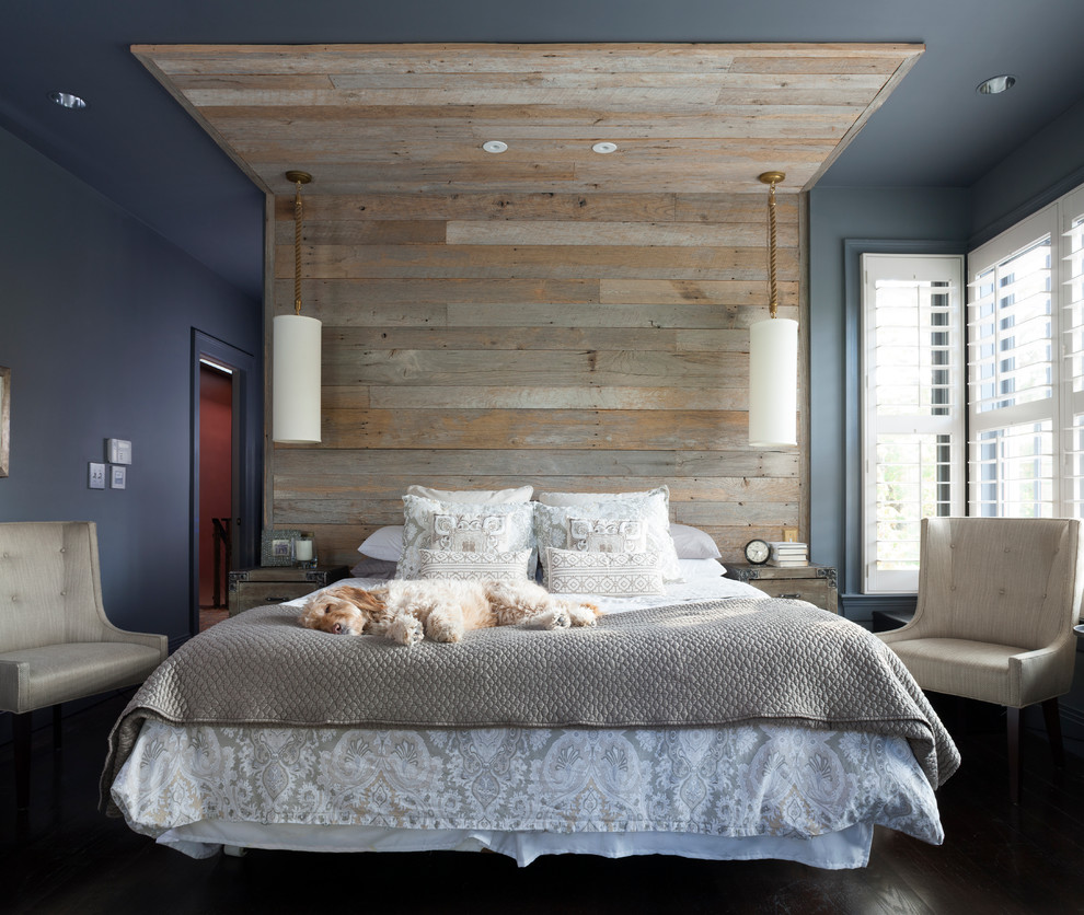 Photo of a transitional master bedroom in DC Metro with blue walls and dark hardwood floors.