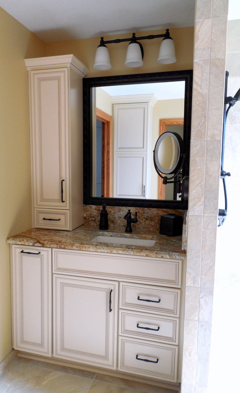 Mid-sized transitional master multicolored tile bathroom photo with an undermount sink, beige cabinets, granite countertops and beige walls