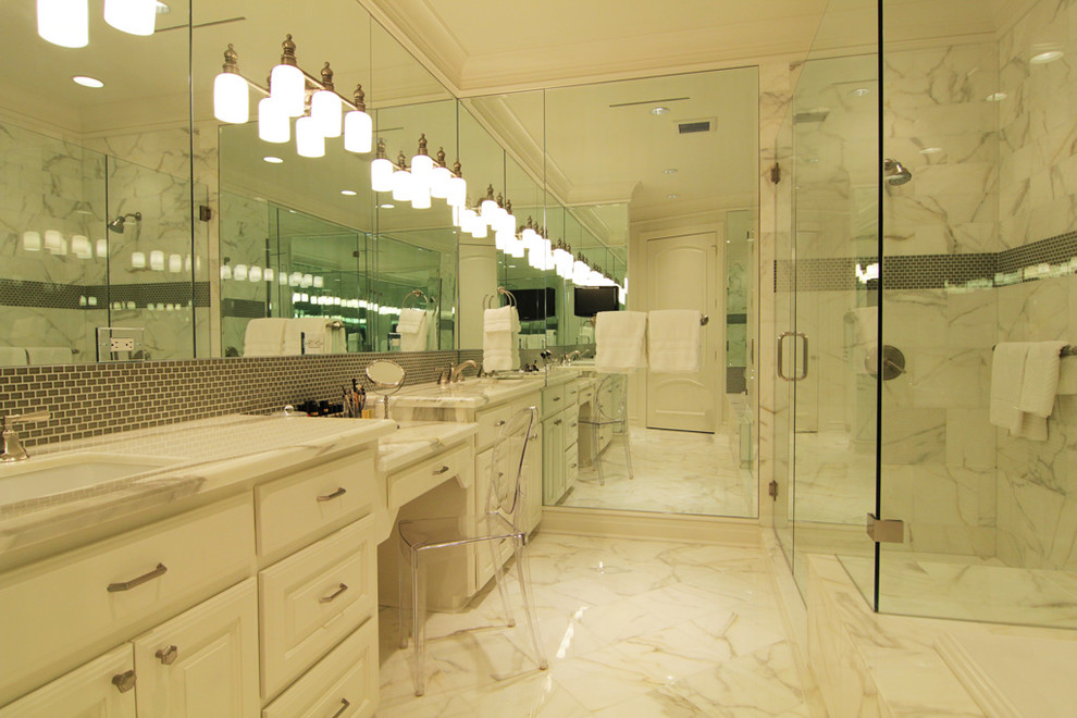 Inspiration for a contemporary bathroom in Houston with white cabinets, white walls, marble floors, marble benchtops and white floor.