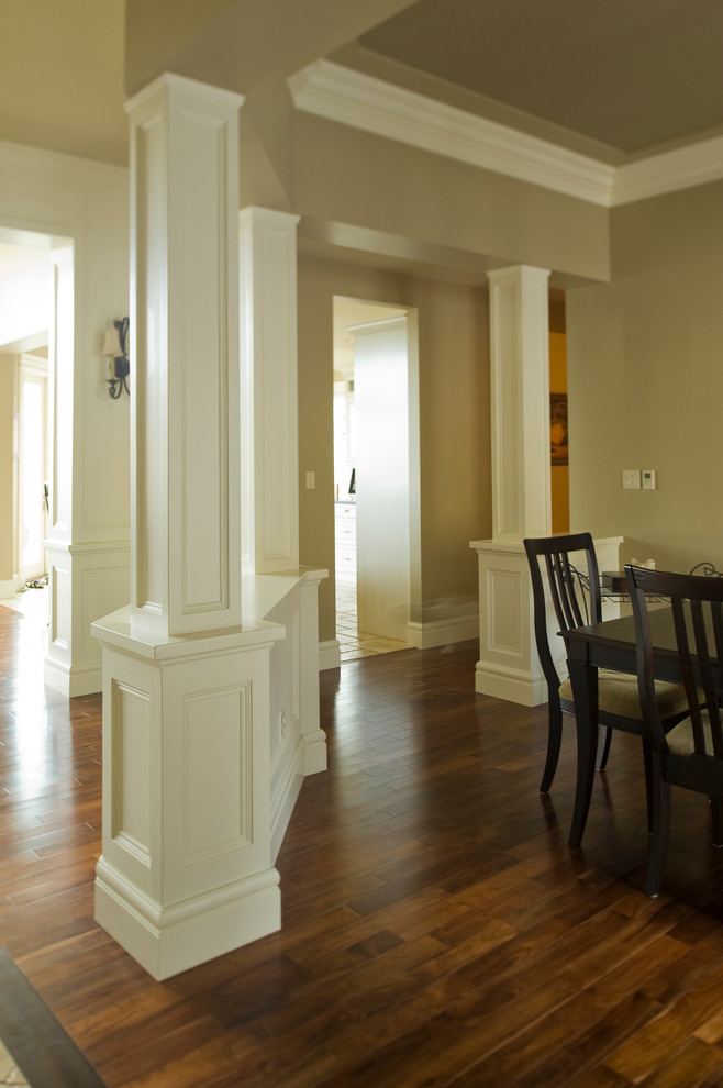 Inspiration for a mid-sized traditional hallway in Calgary with beige walls and medium hardwood floors.
