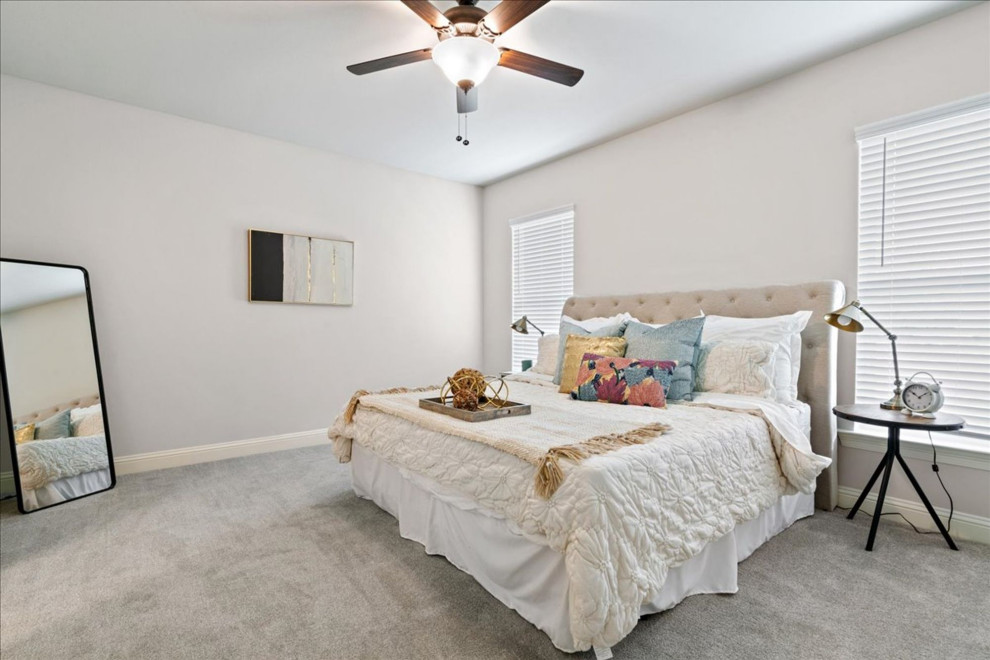 Mid-sized transitional master carpeted and beige floor bedroom photo with gray walls