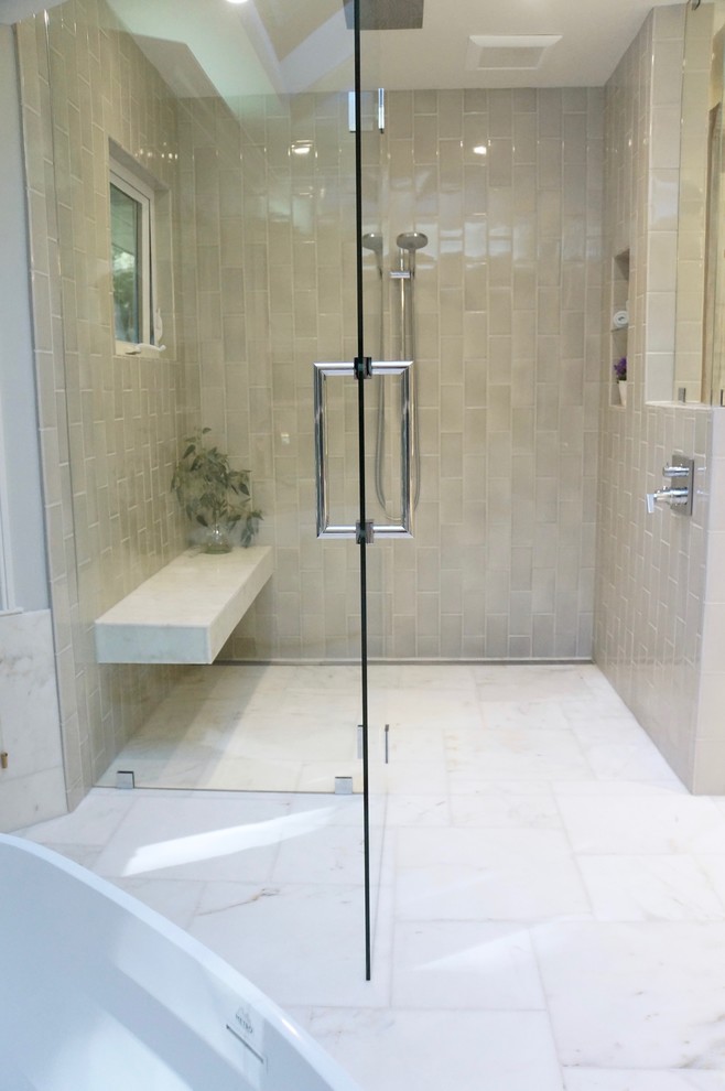 Photo of a large traditional master bathroom in San Francisco with shaker cabinets, white cabinets, a freestanding tub, a curbless shower, a one-piece toilet, gray tile, ceramic tile, grey walls, marble floors, an undermount sink, engineered quartz benchtops, white floor, a hinged shower door and white benchtops.