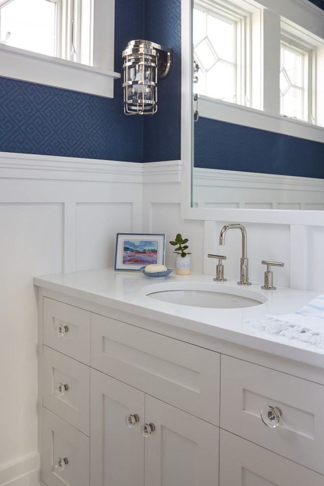 This is an example of a beach style powder room in Portland Maine.