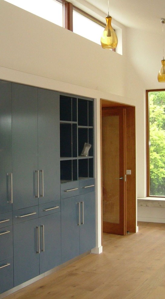 Photo of a contemporary storage and wardrobe in Dublin.