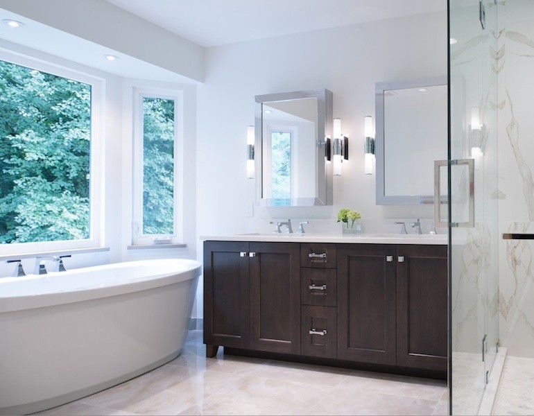 Inspiration for a transitional bathroom in Vancouver with an undermount sink, engineered quartz benchtops and a freestanding tub.