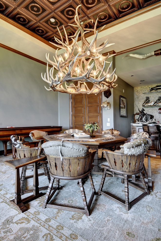 Dining room - rustic carpeted dining room idea in Austin with gray walls